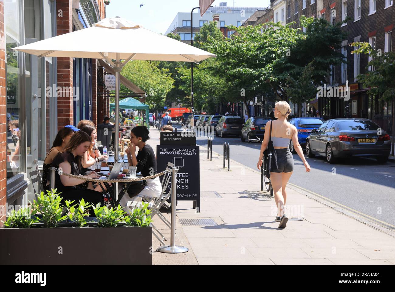 Cafes in spring sunshine on Marchmont Street in Bloomsbury, central London, UK Stock Photo