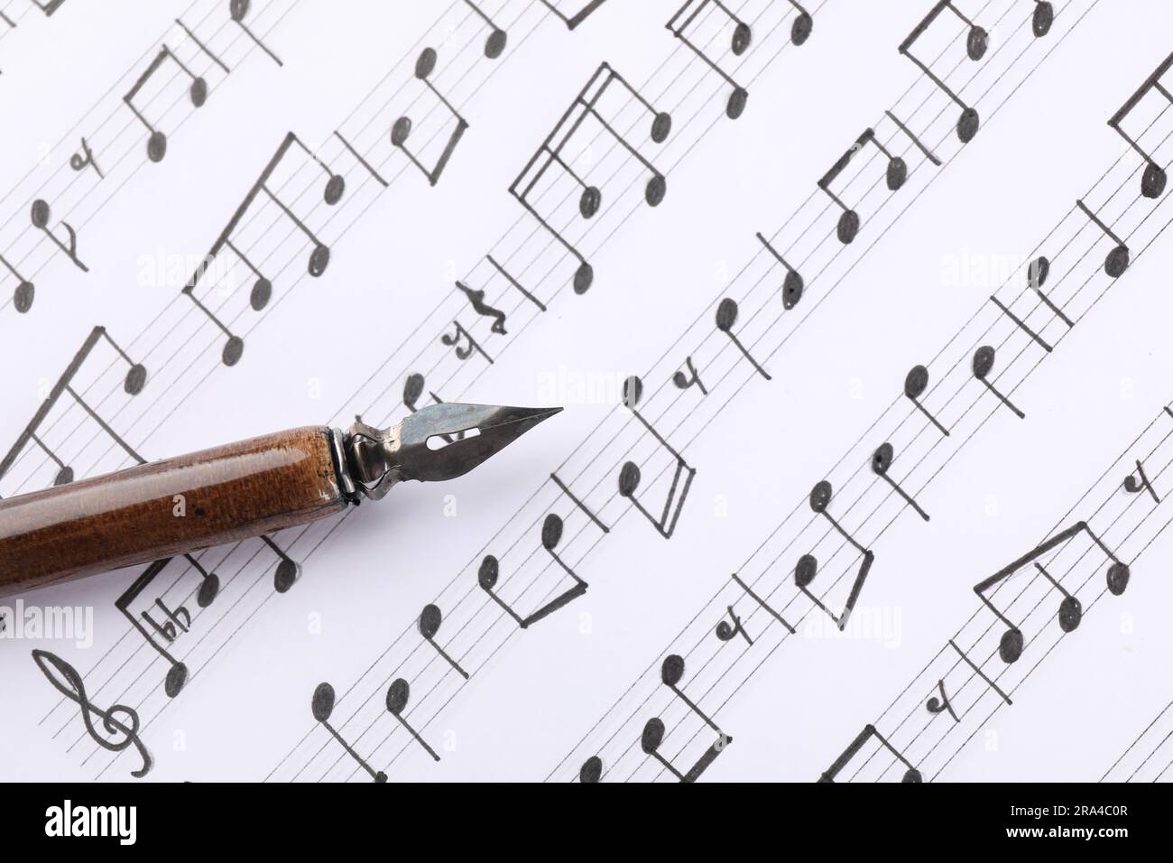 Sheet with musical notes and fountain pen, top view Stock Photo - Alamy