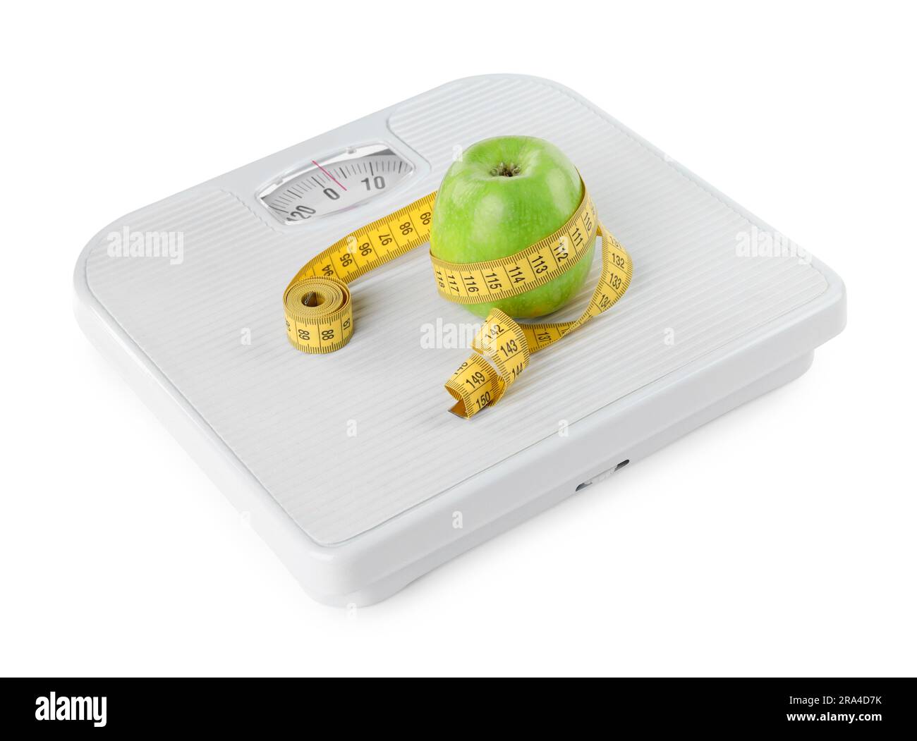 Weight loss concept. Ripe apple and measuring tape on scales isolated ...