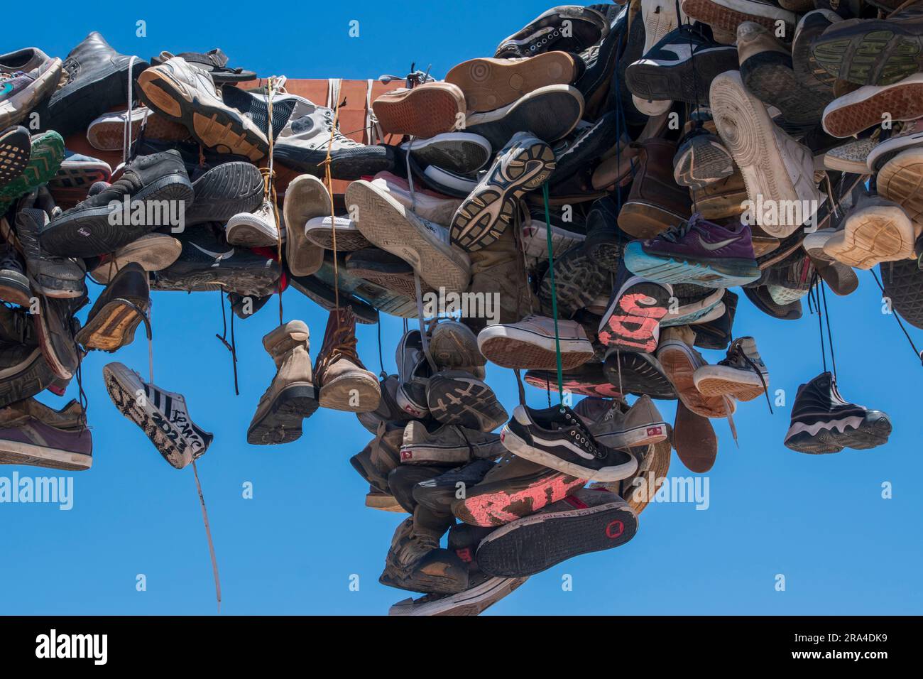 The Rice Shoe Tree is a roadside attraction off State Route 62 in Southern California. Stock Photo