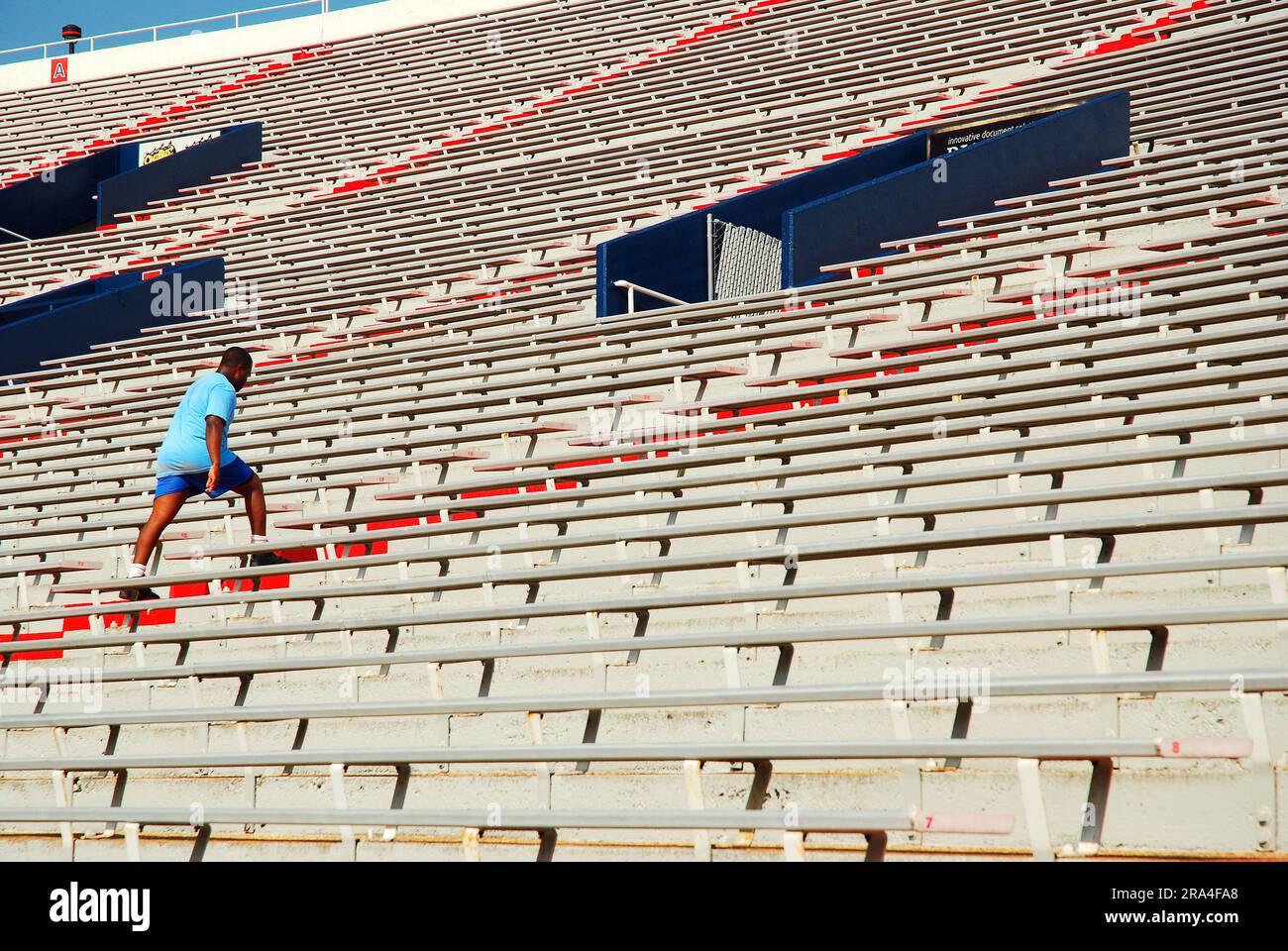 A college athlete uses the steps of the Vaught Hemmingway Stadium at the University of Mississippi as part of his exercise and conditioning routine Stock Photo