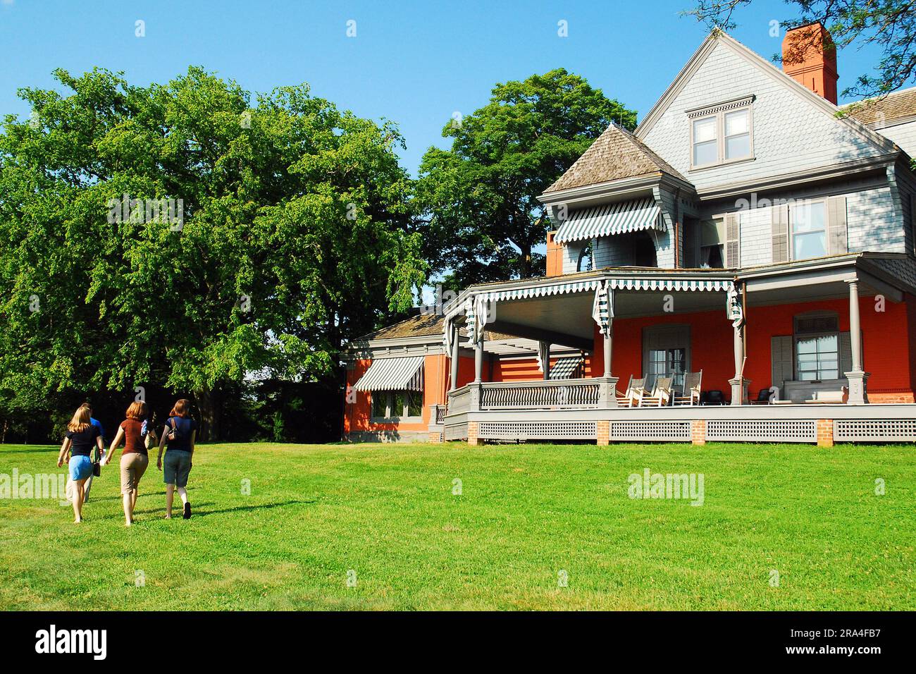 A family strolls the grounds of Sagamore Hill, President Teddy
