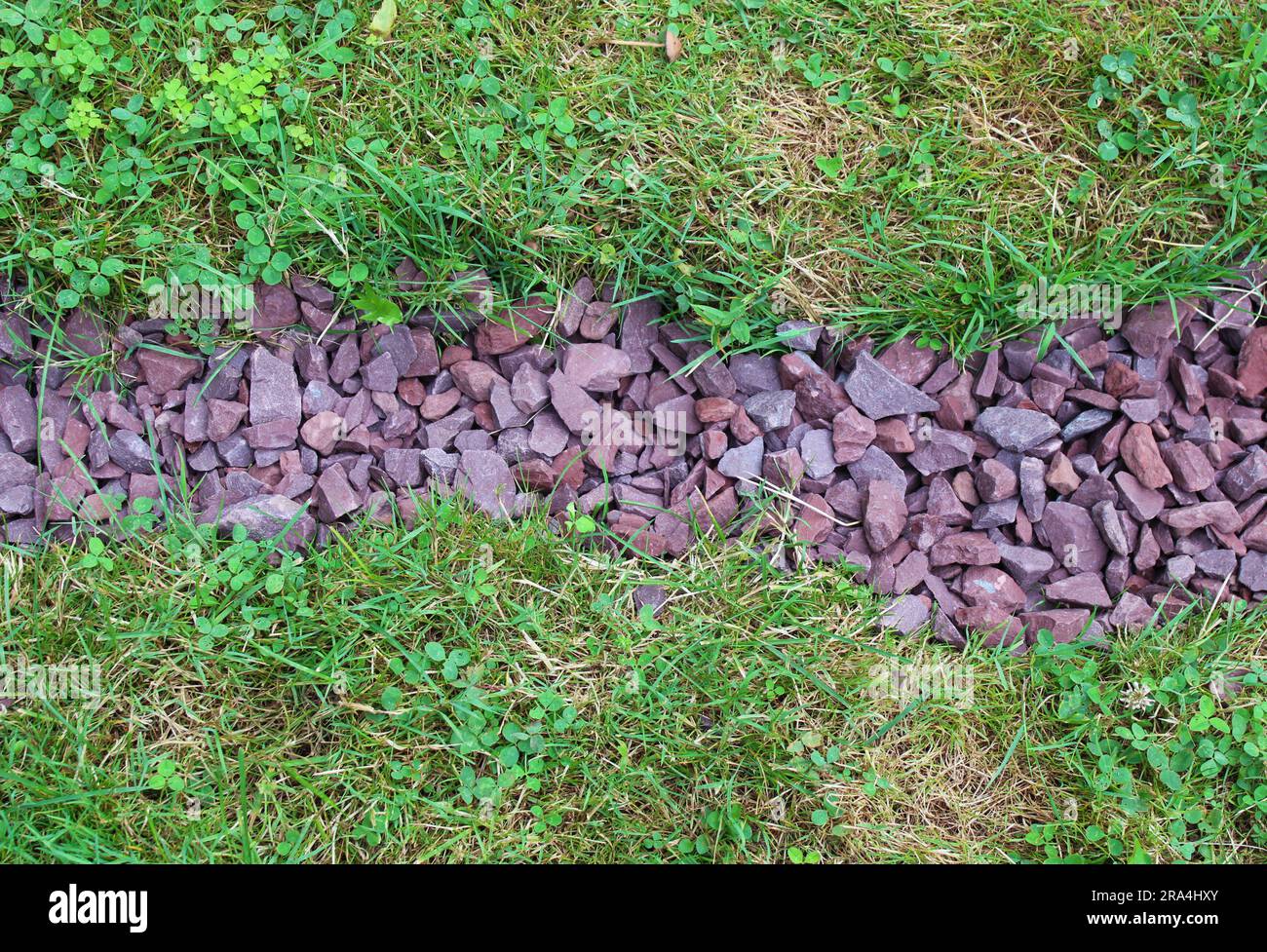Red Gravel Rocks in an Outdoor Drainage Ditch Stock Photo Alamy