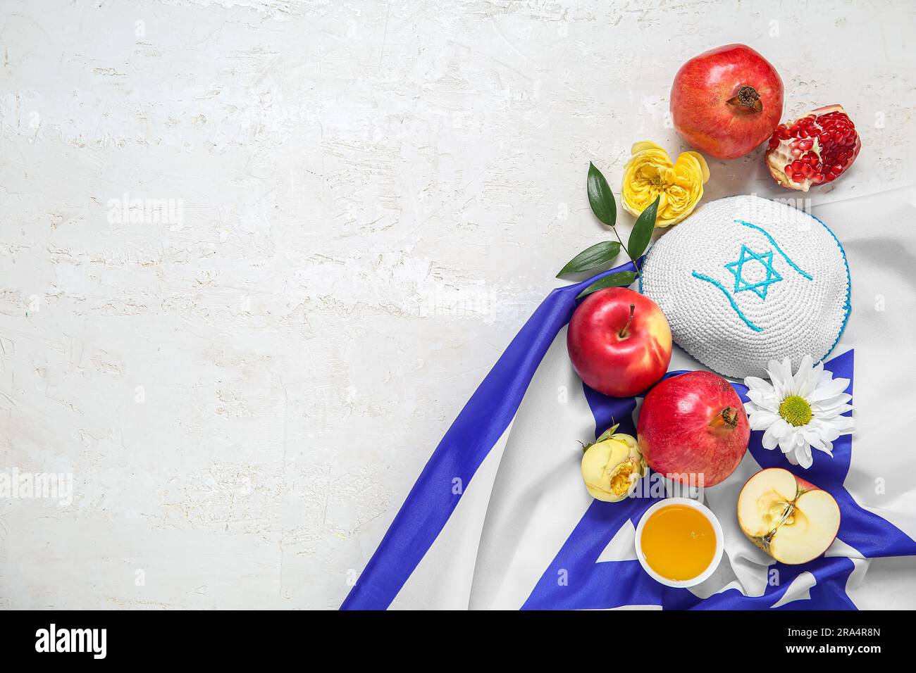 Composition with kippah, flag of Israel, fruits, flowers and honey on