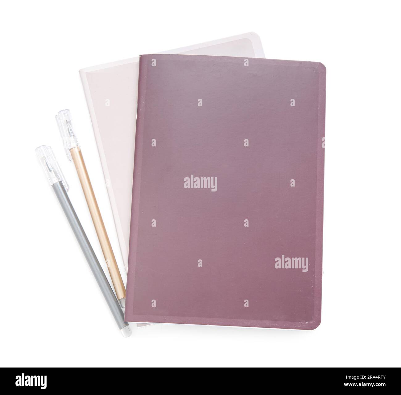Different notebooks with pens isolated on white background Stock Photo