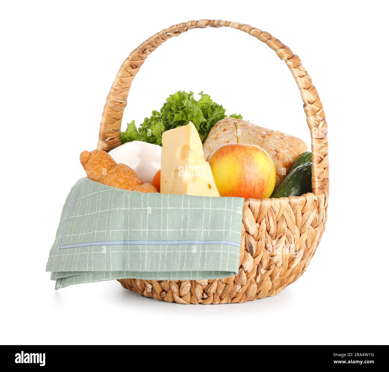 Wicker basket with delicious food for picnic on white background Stock ...