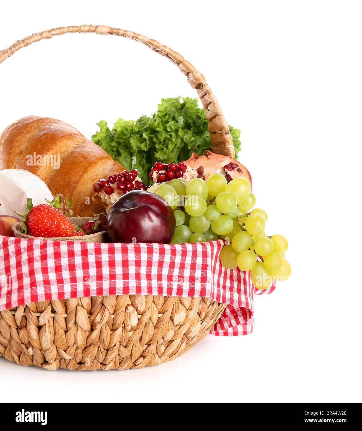 Wicker basket with delicious food for picnic on white background Stock ...