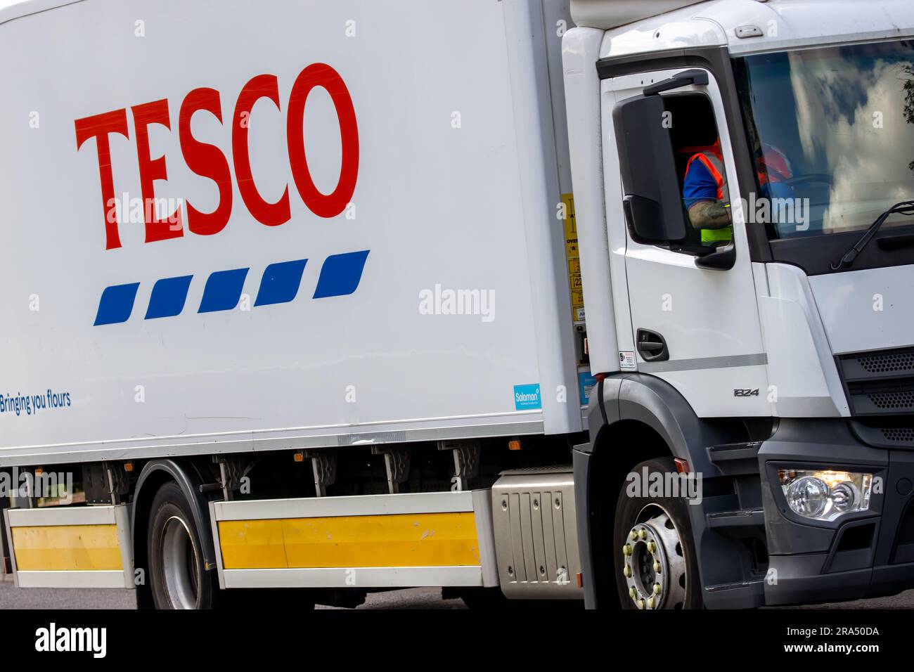Milton Keynes,UK - June 24th 2023.  Close up of a Tesco delivery truck travelling on an English country road Stock Photo
