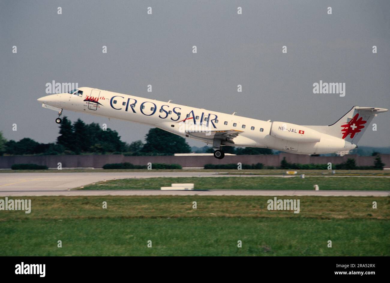 An Embraer ERJ-145 airliner belonging to Crossair of Switzerland, taking off from an airport in 2001. Registration HB-JAL. Stock Photo