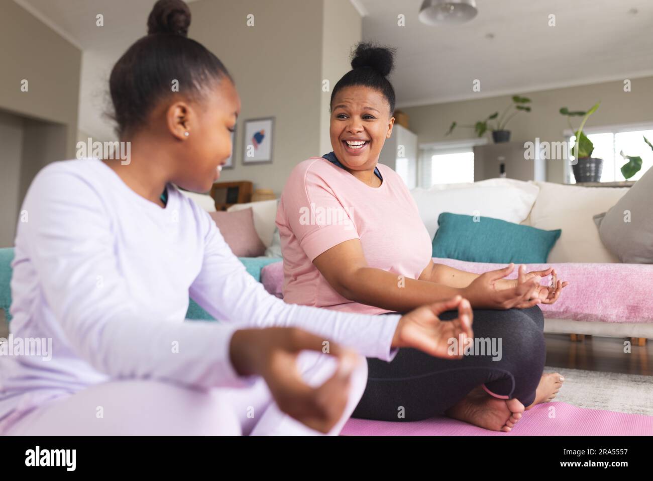 Young mother daughter doing yoga hi-res stock photography and images ...