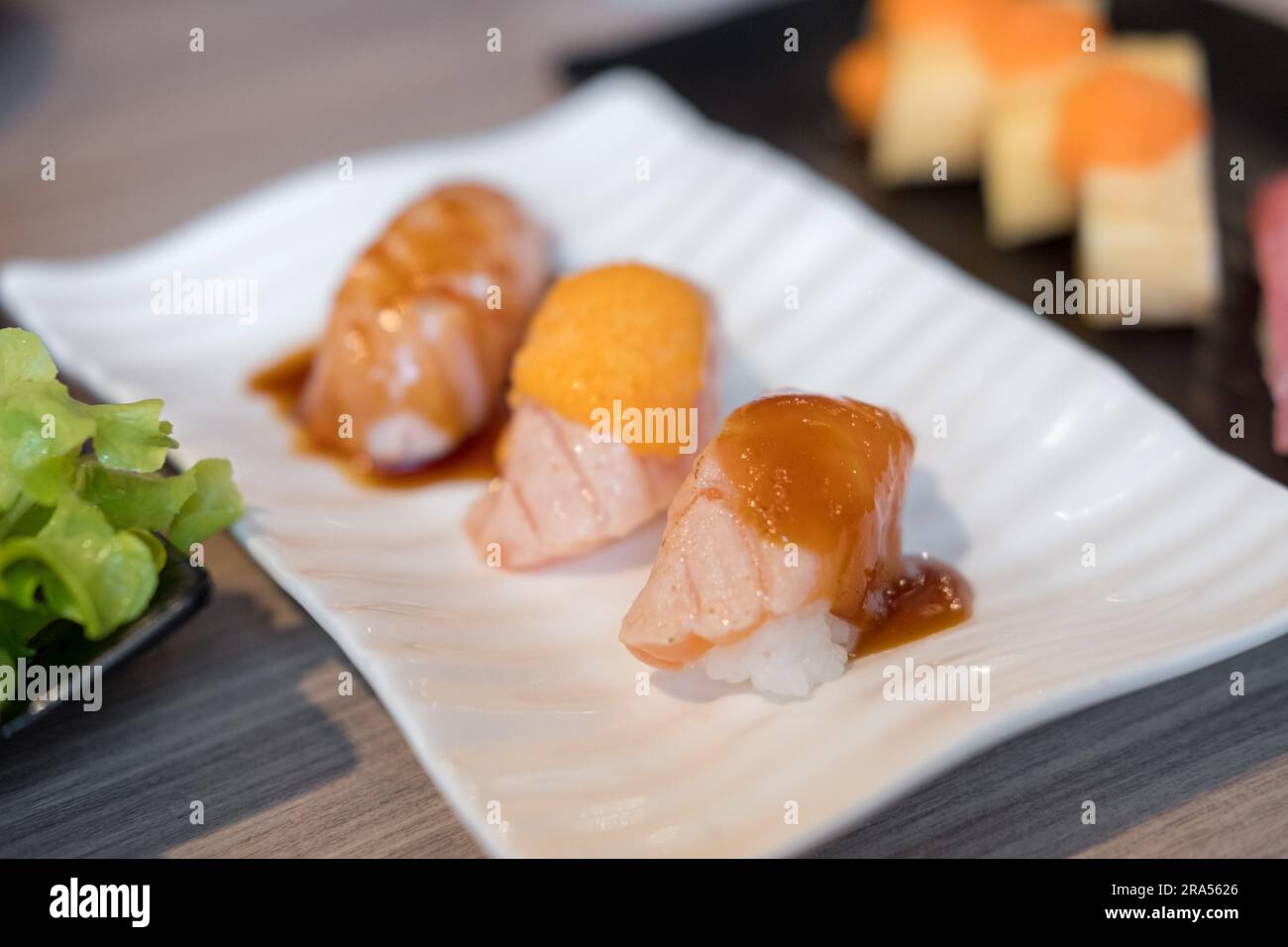 Set of Salmon aburi sushi with saikyo sauce on plate Stock Photo Alamy