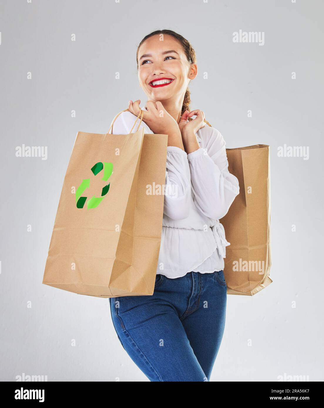 Recycling logo, environment and woman with bag, sustainability with shopping isolated on white background. Environmental, retail and eco friendly Stock Photo