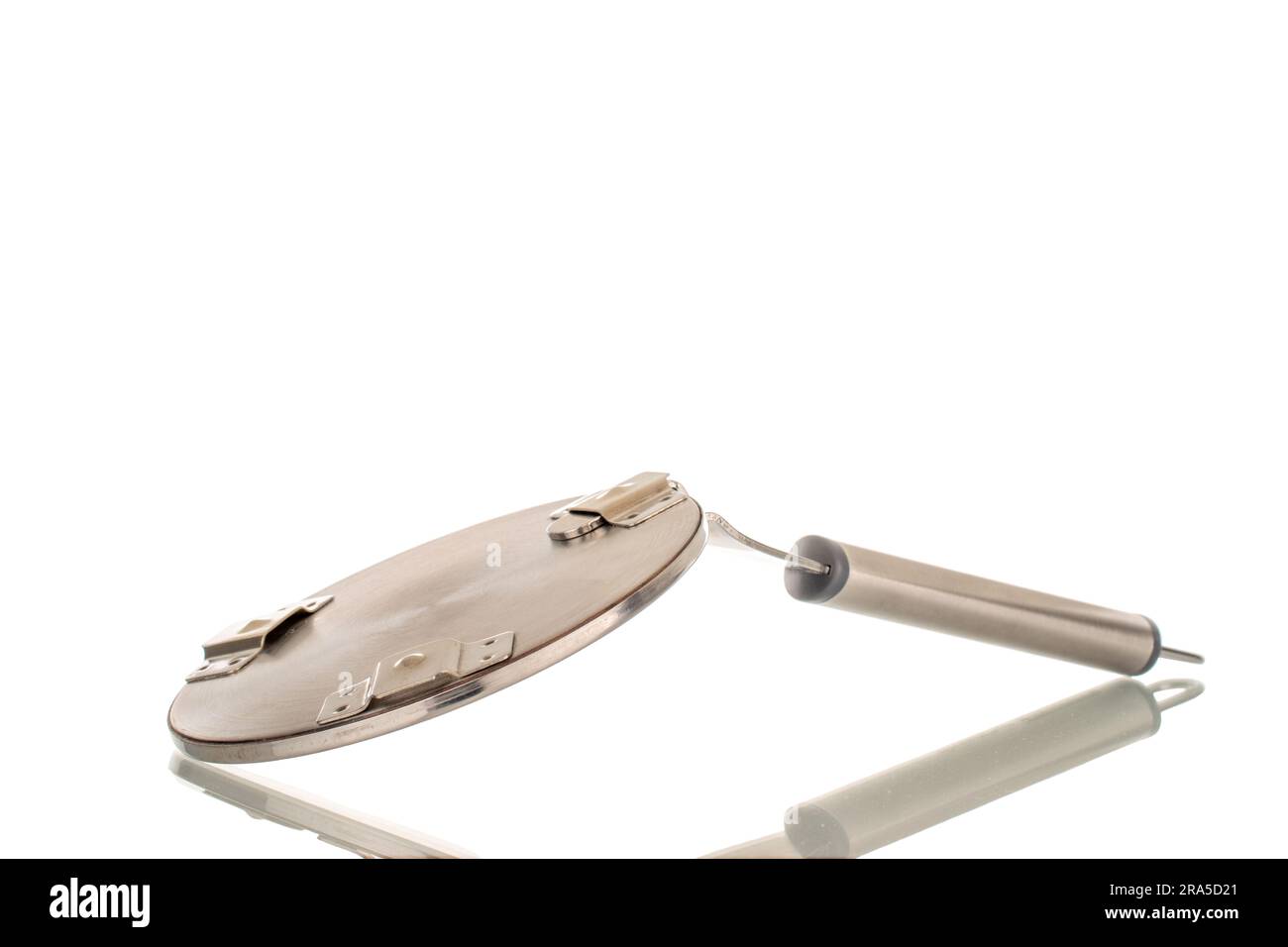 One metal adapter with handle for induction surface, macro, isolated on