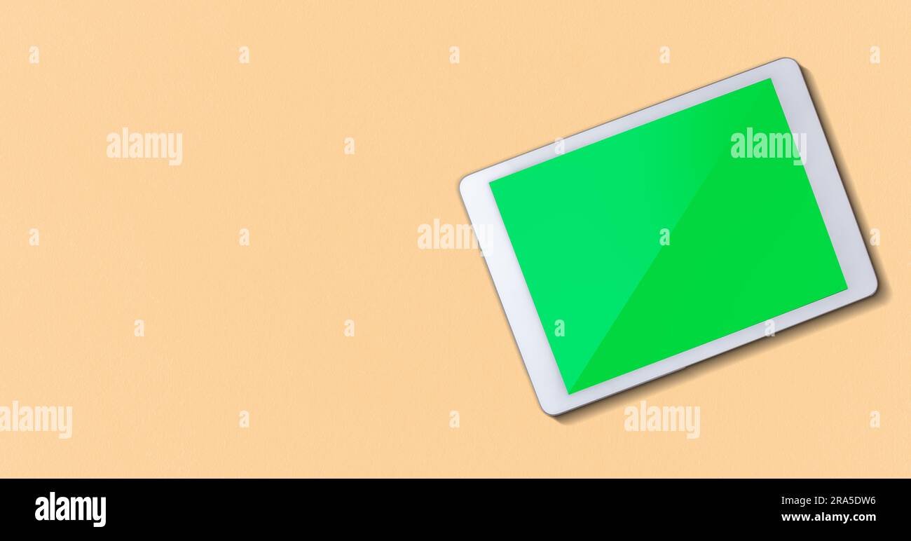 Banner with digital tablet mockup green screen and copy space. Stock Photo