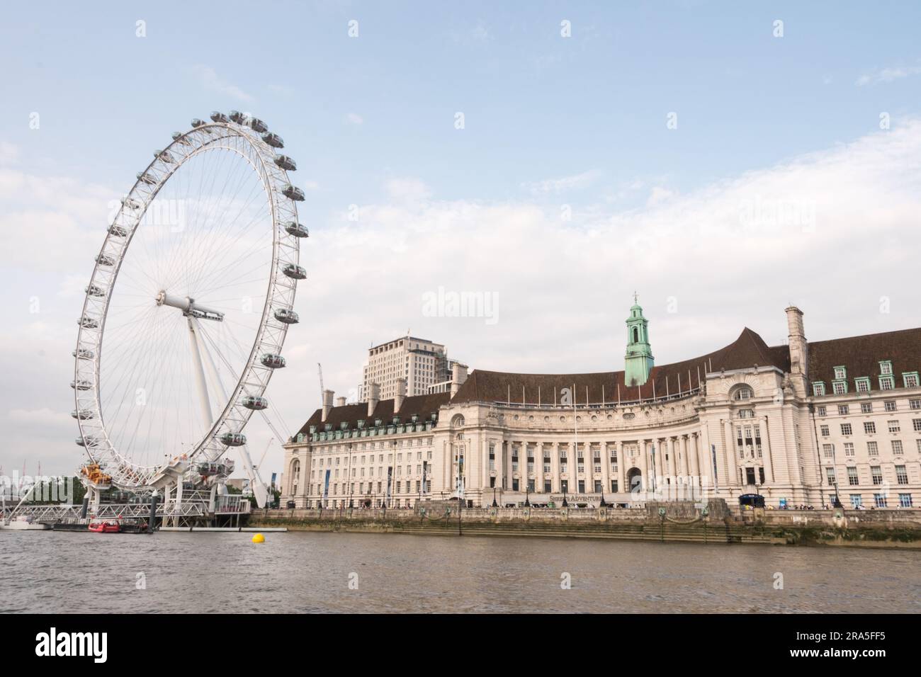 The Millenium Wheel and the old London County Hall building on the South Bank of the River Thames, London, England, U.K. Stock Photo