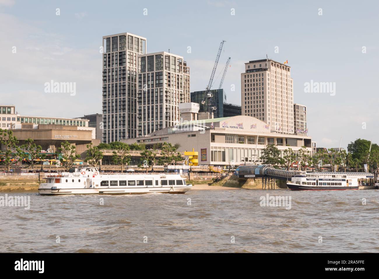 The Royal Festival Hall and Shell House on the Southbank of the River Thames with encroaching skyscrapers in the background, London, England, U.K. Stock Photo