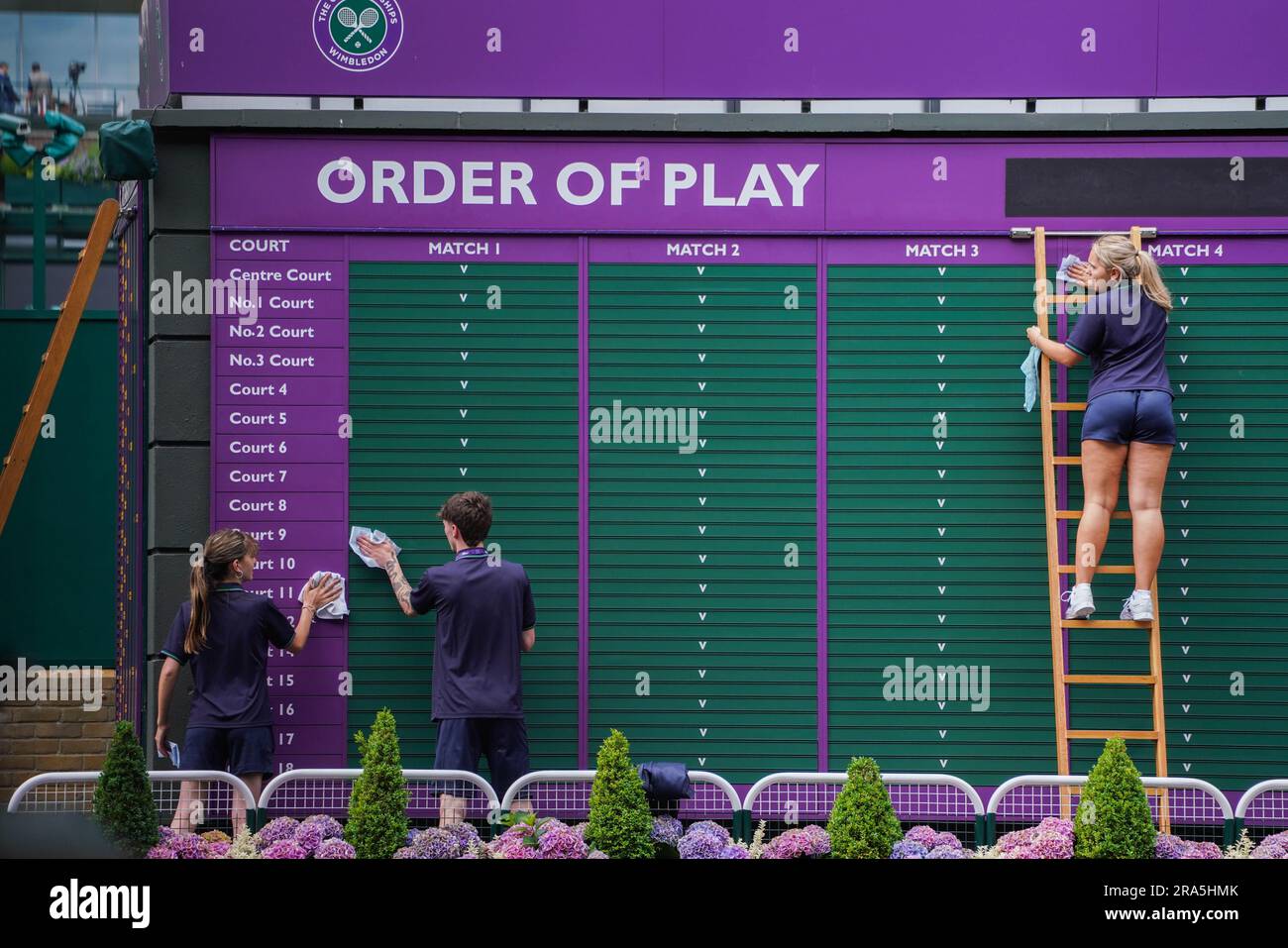 London UK. 1 July 2025 Staff wipe and clean the Order of Play board at