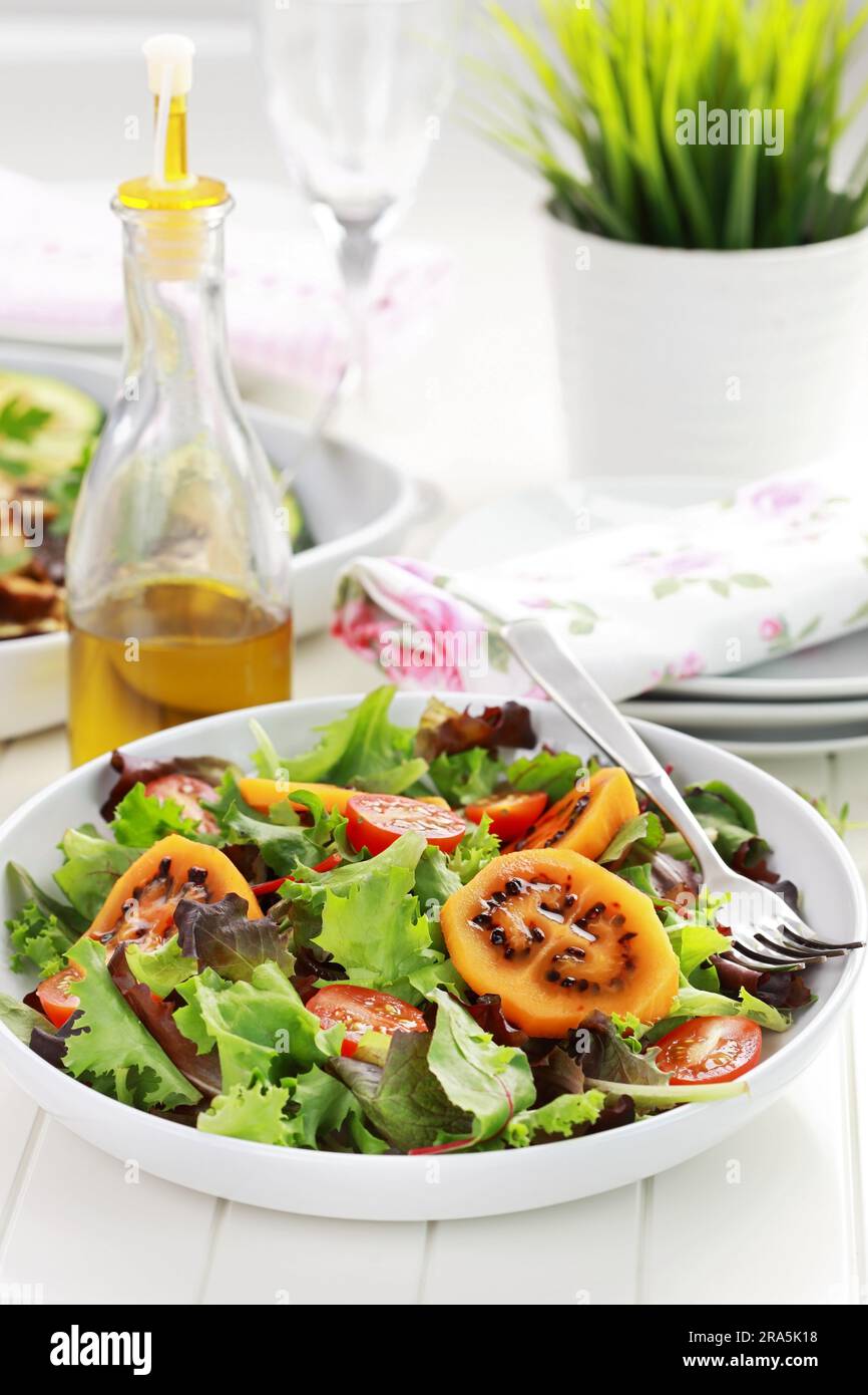 Delicious salad with tamarillos and olive oil Stock Photo