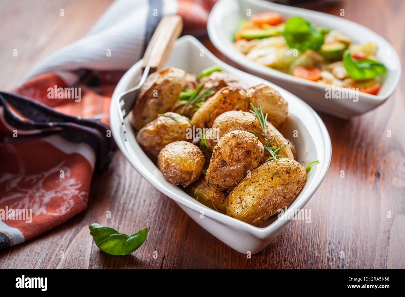 Oven baked potatoes with cabbage salad Stock Photo Alamy