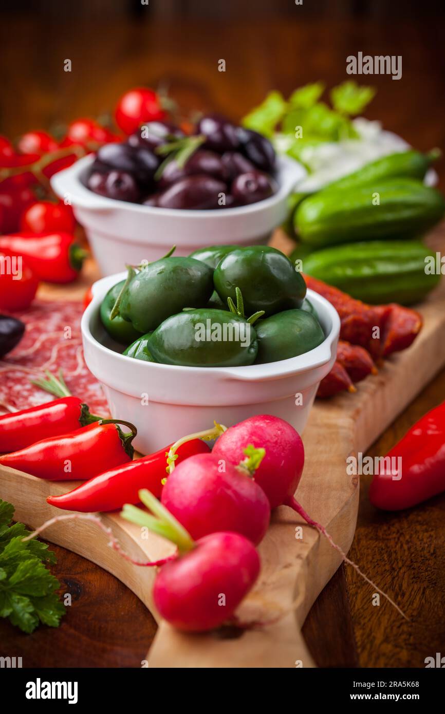 Raw vegetables, yogurt dip and antipasti Stock Photo - Alamy
