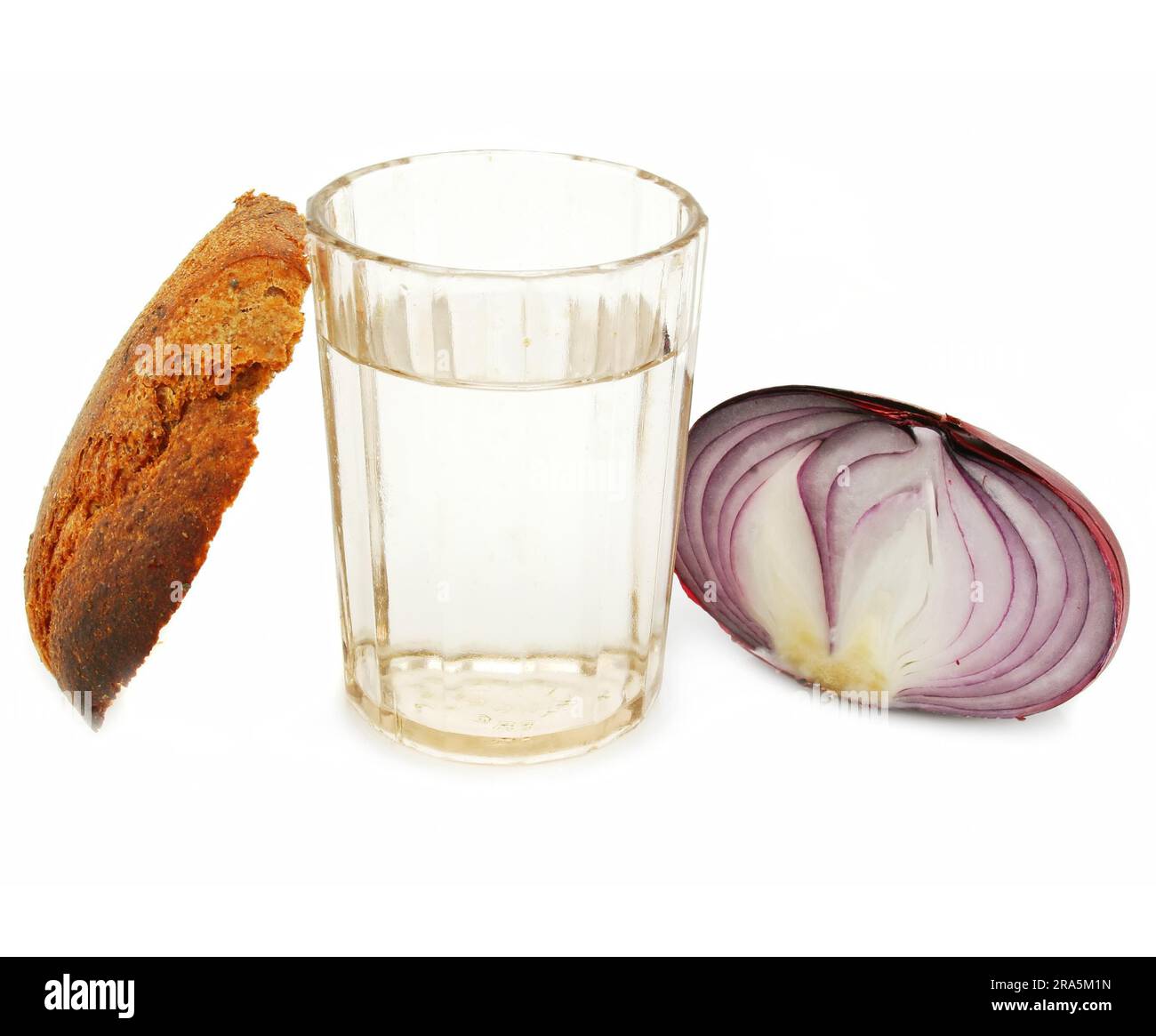 Crust of bread, glass of alcohol and onion isolated Stock Photo