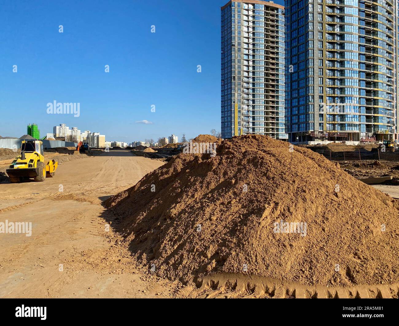 Sand Making Large Building A large pile of yellow sand for the repair and construction of tall new ...