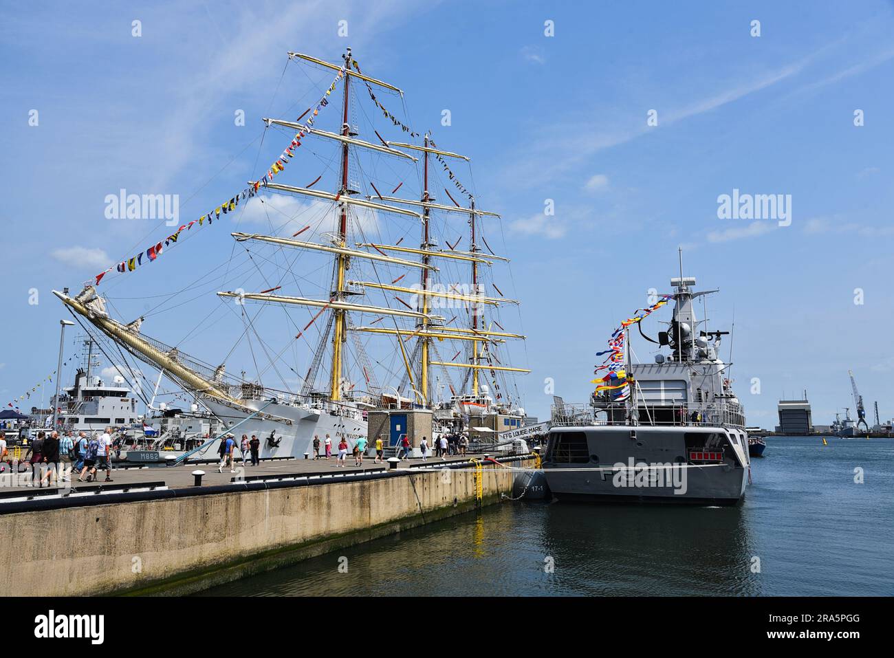 Den Helder, Netherlands. 30 June 2023. A Polish tall ship and a Dutch frigate at the quay in Den helder during Sail 2023. High quality photo Stock Photo