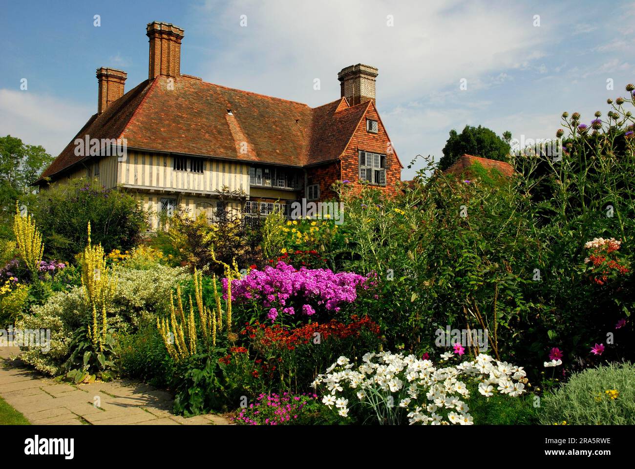House and garden with Phlox (Phlox) and Mulleins (Verbascum) Great Dixter, Northiam, Kent, England, Great Britain Stock Photo