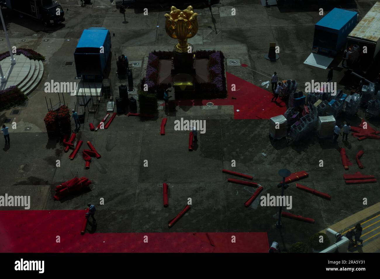 Staff dismantle the red carpet after the ceremony marking the 26th ...