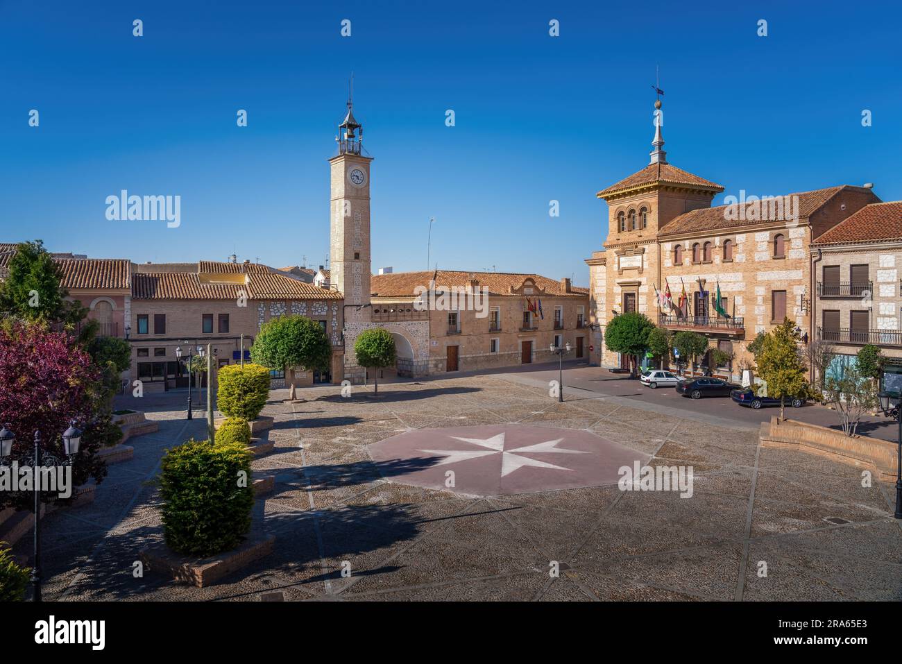 Plaza de Espana Square with Clock Tower (Torre del Reloj) and Consuegra City Hall - Consuegra, Castilla-La Mancha, Spain Stock Photo