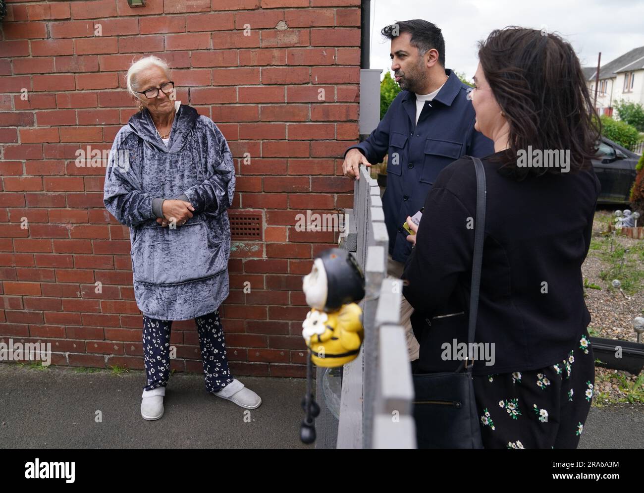 First Minister Humza Yousaf chats with locals whilst handing out