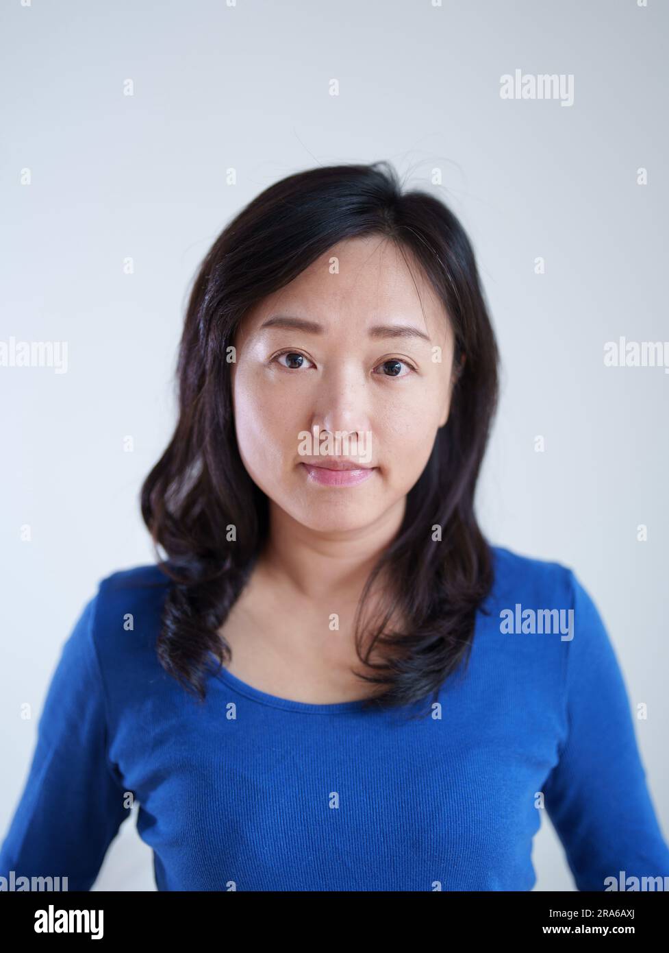 Portrait of an Asian woman wearing a blue top Stock Photo