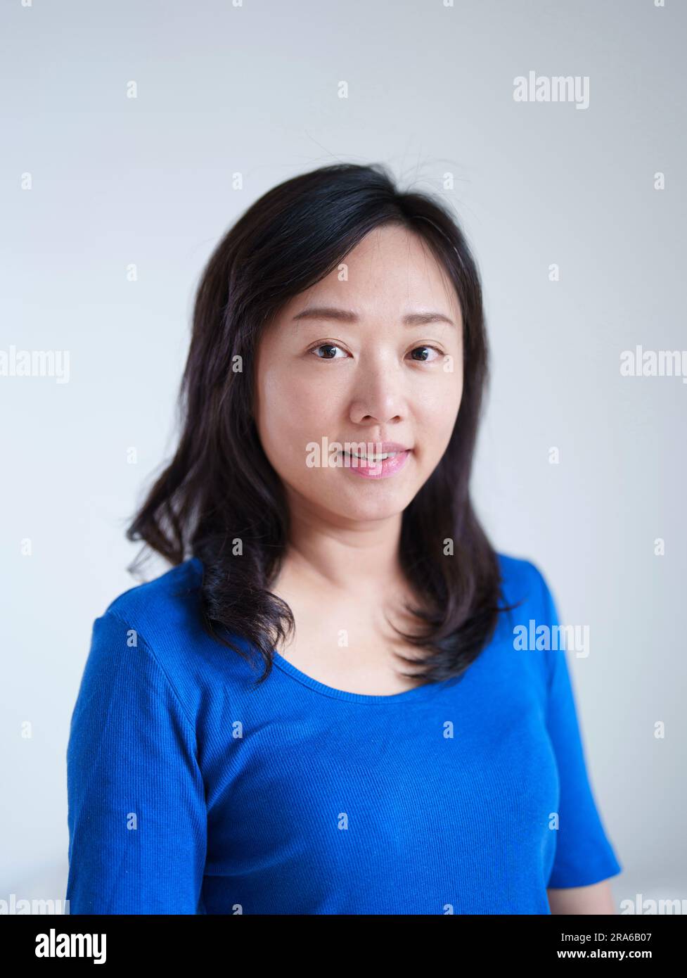 Portrait of an Asian woman wearing a blue top Stock Photo