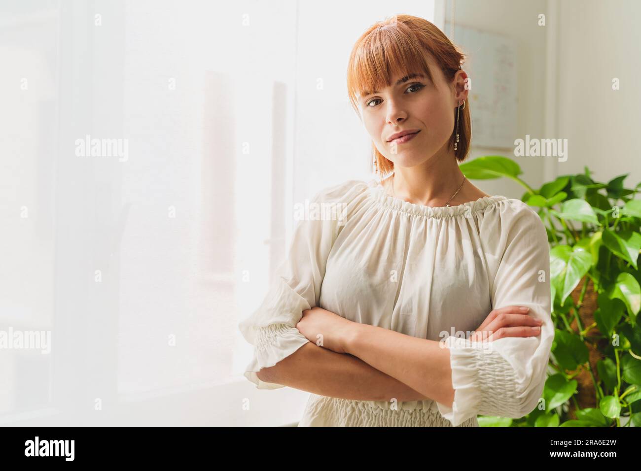 Portrait of a stylish 25yearold businesswoman in light blouse at her