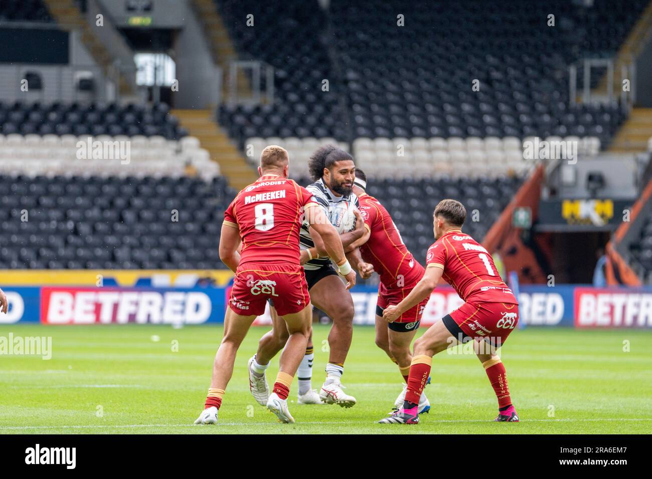 Hull, UK. 1st July 2023. Betfred Super League - Round 17: Hull FC v Catalans Dragons. Mike McMeeken and Arthur Morgue, Catalans Dragons tackle Chris Satae, Hull FC. Credit Paul Whitehurst/Alamy Live News Stock Photo