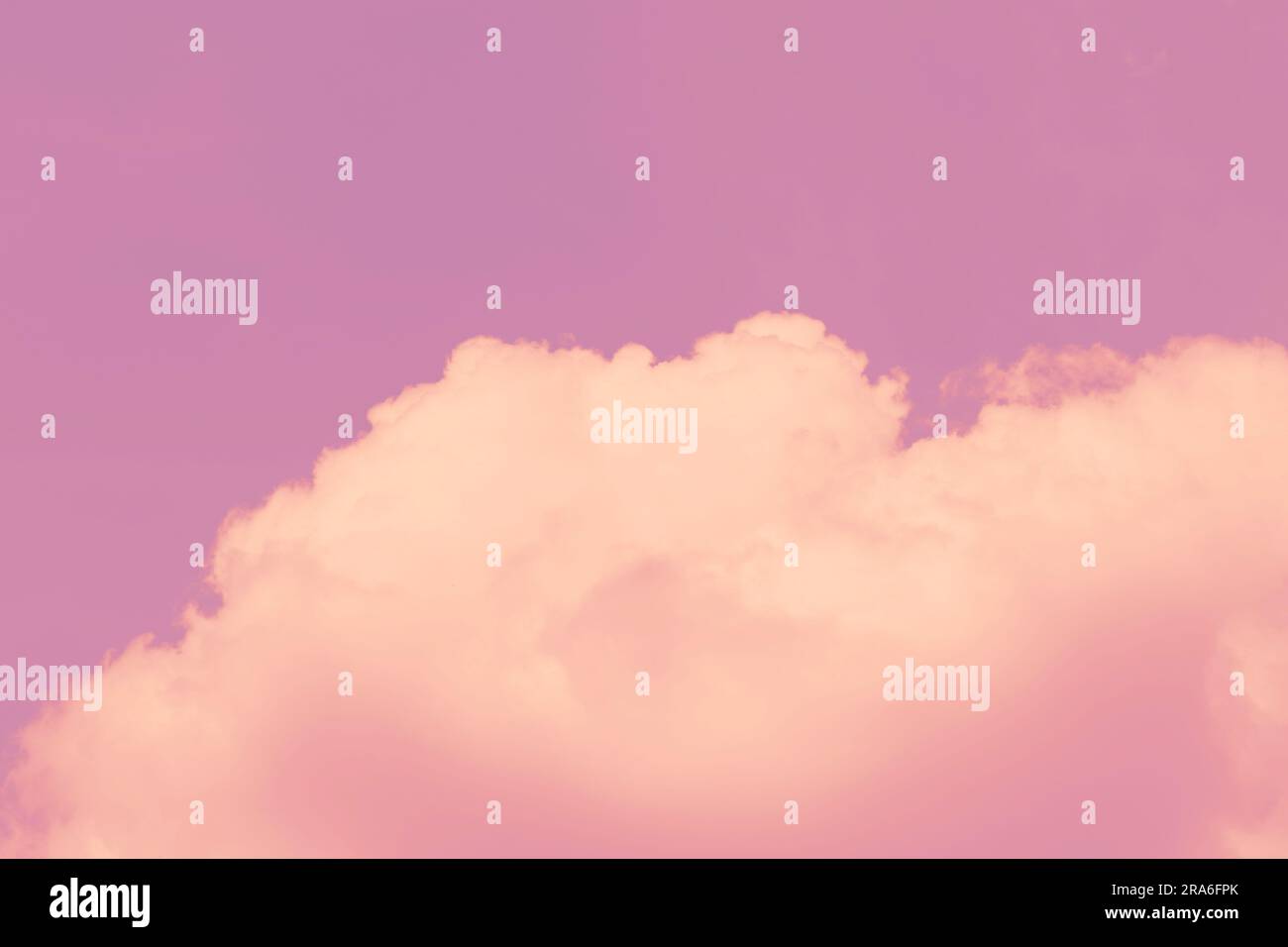 Vintage tone pink sky background with white clouds, fantasy big cloud sky scape for love postcard background. Stock Photo