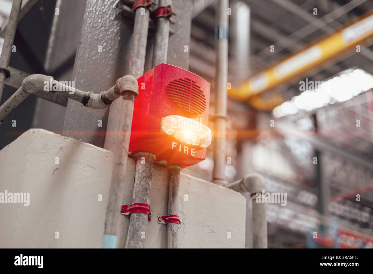Fire Alarm Fire Detector with quick strobe light alert speaker wall mount for industrial building safety equipment. Stock Photo