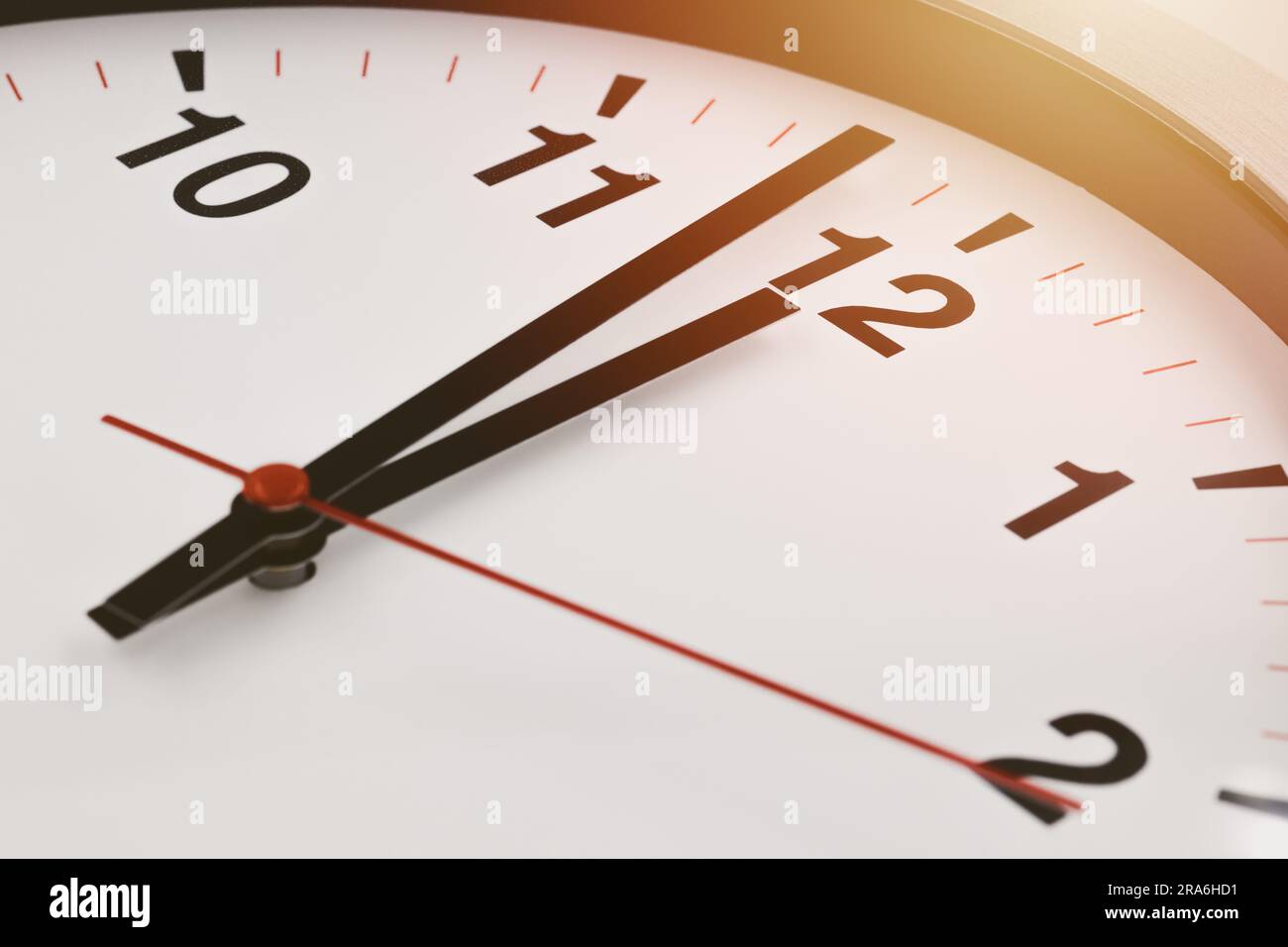 Afternoon 12 o'clock time clock face closeup for lunch brake business working hours. Stock Photo