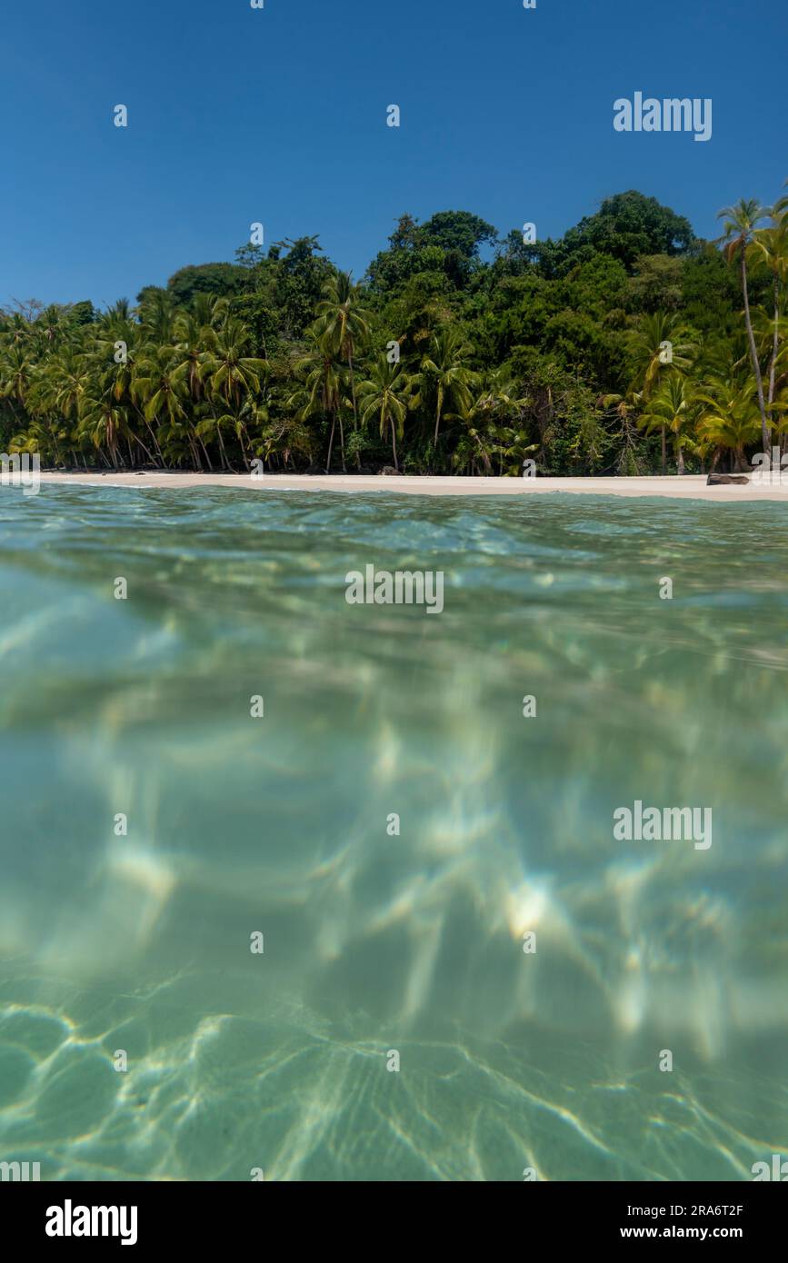 Tropical island beach beyond ocean surface, Coiba island, Pacific Ocean, panama - stock photo Stock Photo