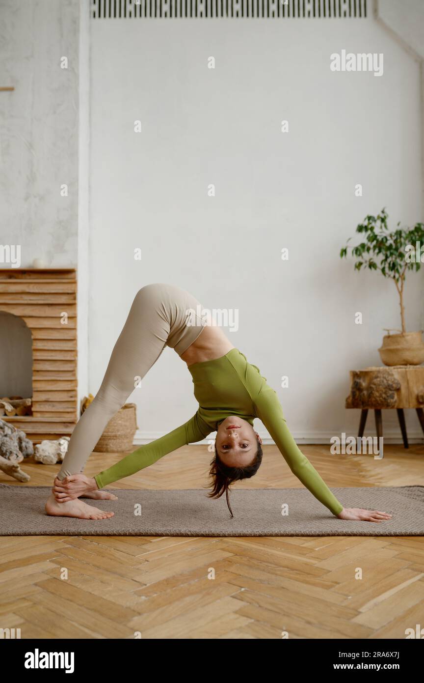 Young yogi woman stretching hi-res stock photography and images - Alamy