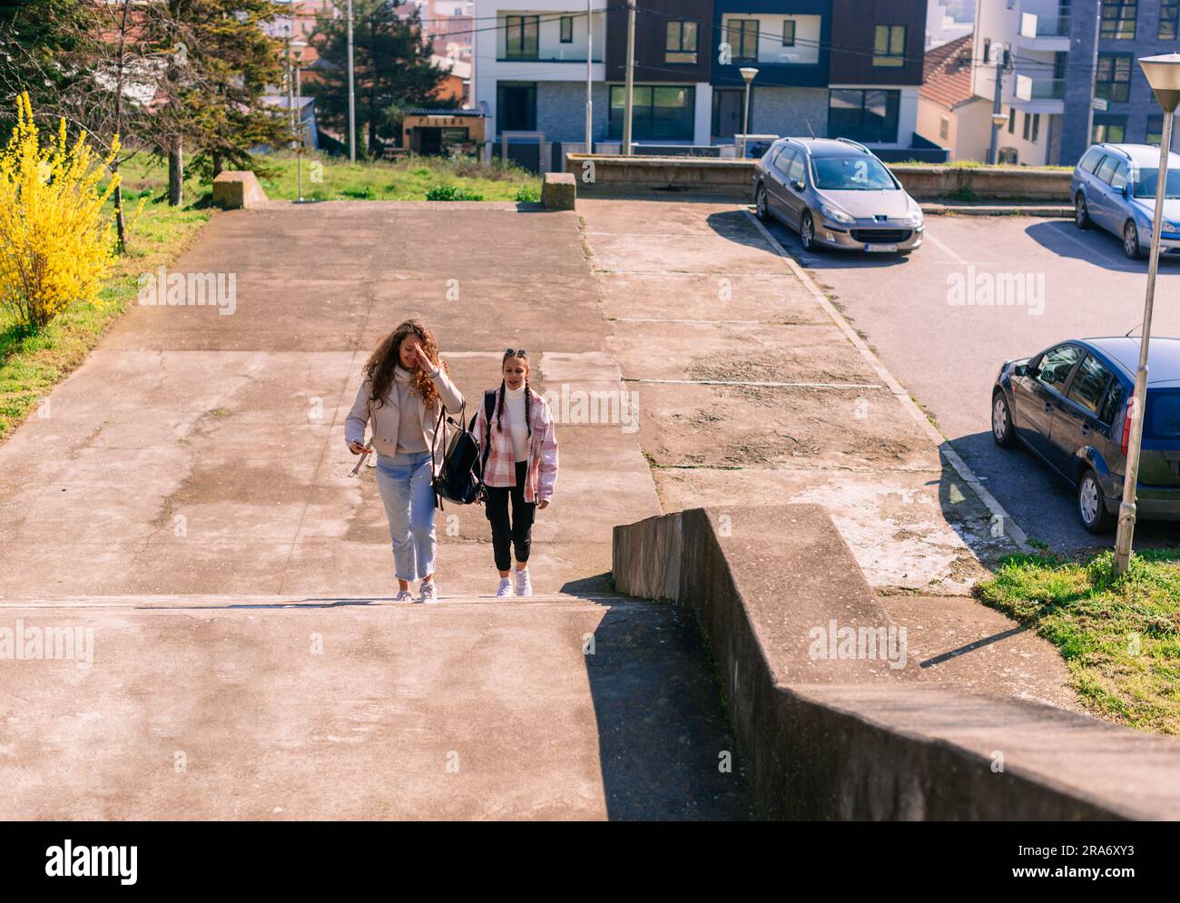 High school girls walking upstairs. Going to school concept Stock Photo ...