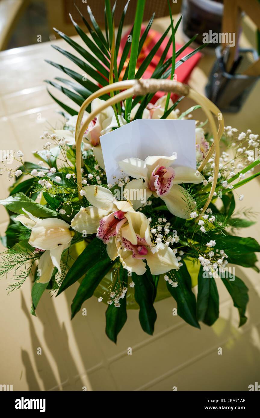 Top view beautiful bouquet of orchid flowers with inserted empty