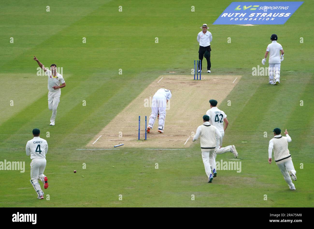 Australia's Mitchell Starc (left) celebrates the wicket of England's