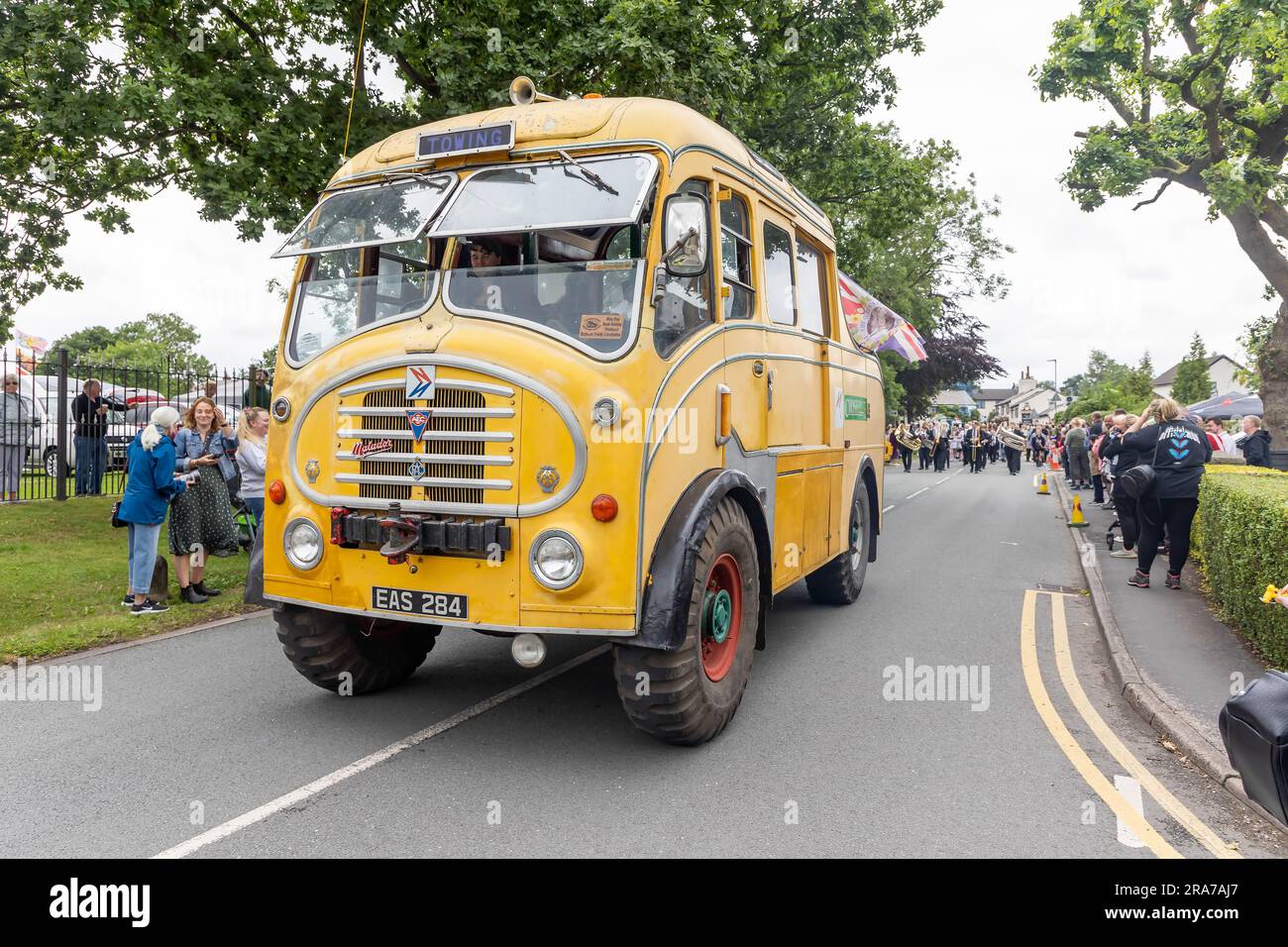 July 2023 - Croft Carnival parade with heavy trucks passing through the village. This one was in 'On the Buses' TV programme Stock Photo