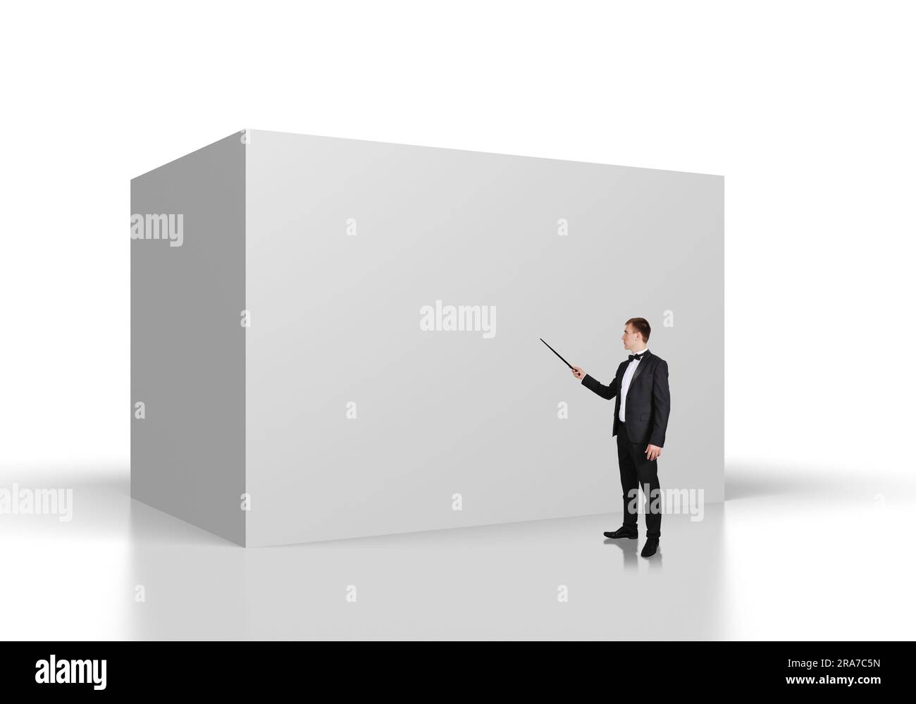 businessman points on the pointer to big concrete wall Stock Photo