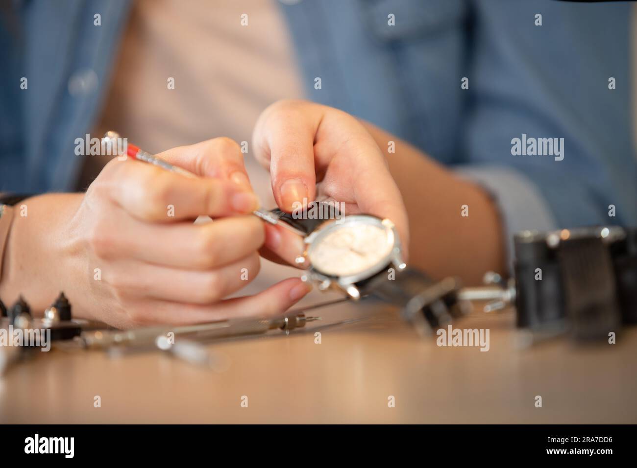 cropped image of watch being repaired with a precision screwdriver Stock Photo