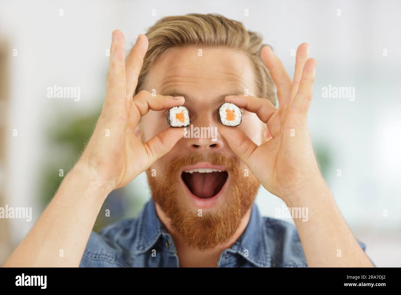 young man with sushi eyes Stock Photo