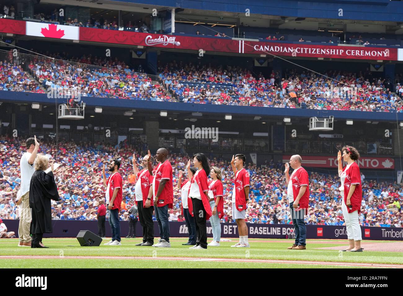 Toronto, Canada. 01st July, 2023. People take part in a Canada Day  citizenship ceremony before the start of MLB AL baseball action between the  Toronto Blue Jays and the Boston Red Sox