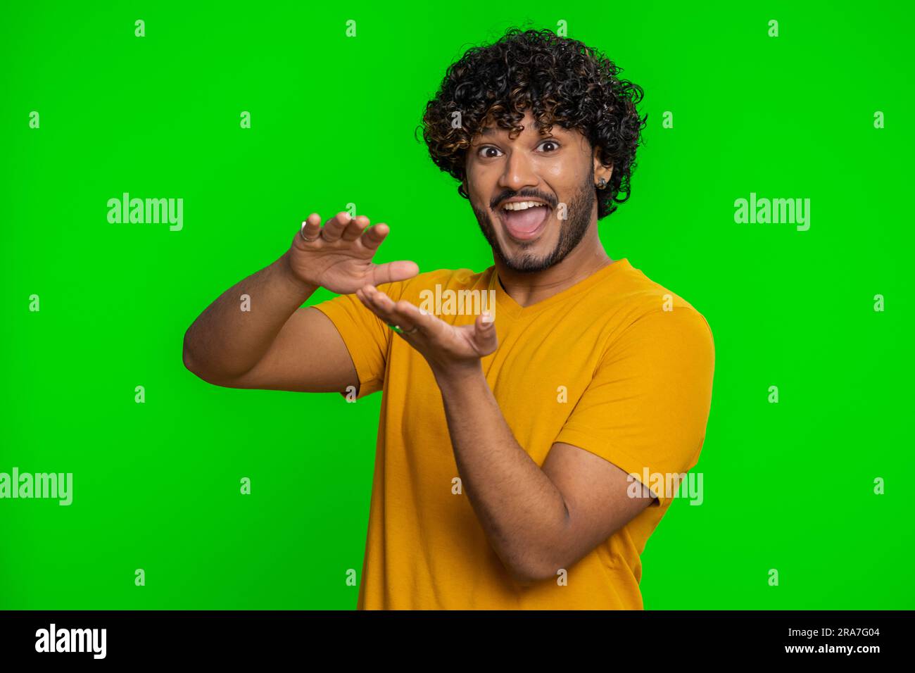 Young indian man showing wasting, throwing money around, more tips, big