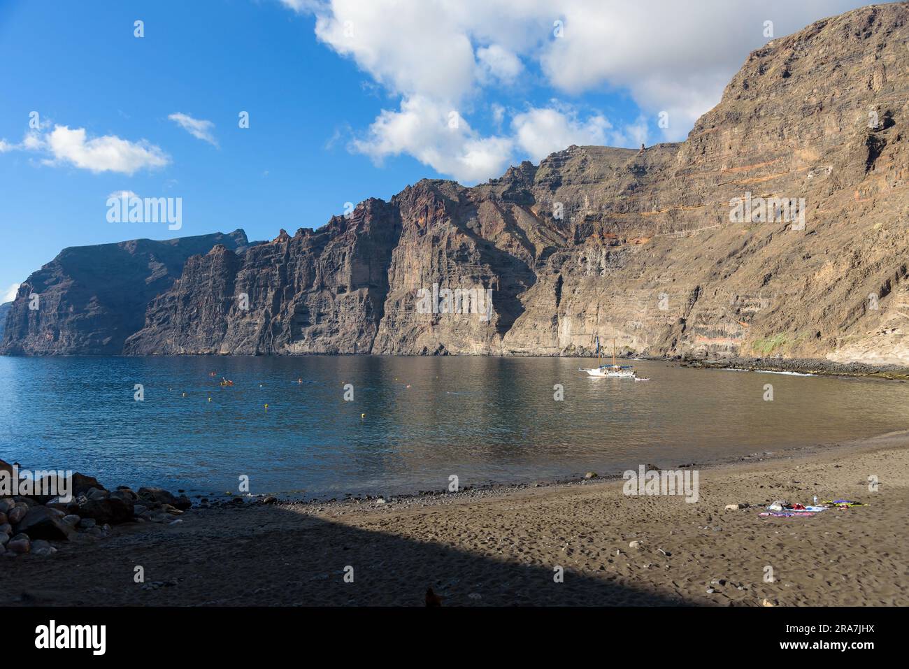 View of massive cliffs of Los Gigantes on the western coast of Tenerife from Los Guios beach. Canary Islands, Spain Stock Photo